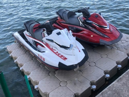 2 jet skis drive on floating dock